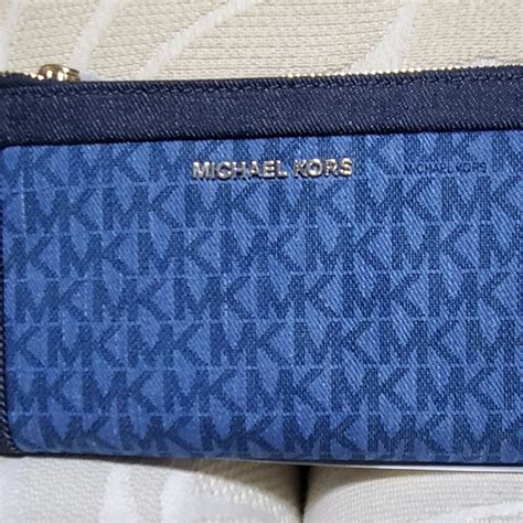 are michael kors denim purses treated to protect the fabric|Michael Kors denim wallet.